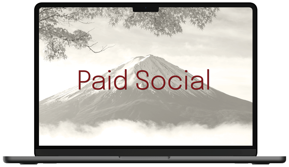 Laptop with Paid Social text